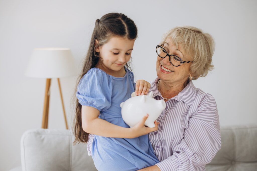 grandmother-and-her-granddaughter-putting-coin-mon-2025-02-16-17-14-11-utc (1)